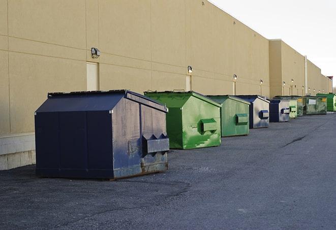 an assortment of sturdy and reliable waste containers near a construction area in Benton TN